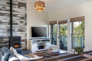 Great room with access to upped deck; stunning view of the lake and mountains!