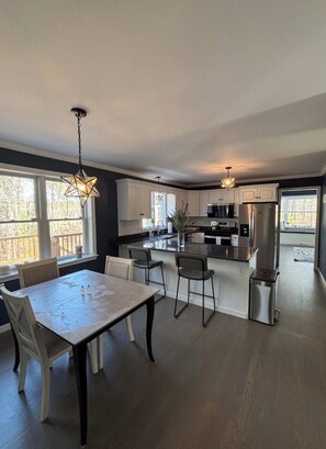 Our kitchen! Table with 4 chairs and 2 bar chairs.