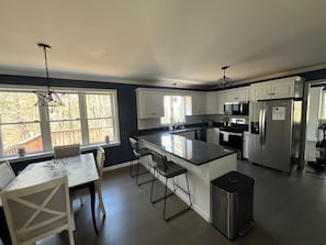 Full open kitchen concept, microwave, stove coffee area etc.