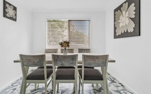 Gather around the six-seater dining table to swap stories and savour meals after a day soaking up the best of Surfers Paradise.