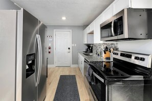 Fully equipped kitchen in this cute, open concept home!