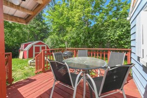 Outdoor dining area and fire pit in the private back yard