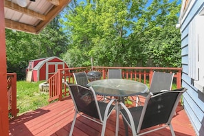 Outdoor dining area and fire pit in the private back yard