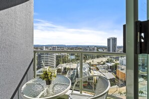 Enjoy your morning coffee in this cozy balcony overlooking the Gold Coast