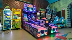 Unleash your inner gamer in our exciting game room featuring Duck Catcher, Lane Master, and Toy Taxi. Endless entertainment at Regal Palms Resort!