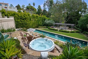 The backyard features stunning 60ft lap pool and hot tub!