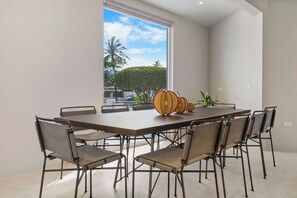Gather around the dining table in our spacious dining area, perfect for sharing meals and making memories. Whether it's a casual breakfast or a special dinner, this inviting space sets the scene for great conversations and delicious meals.