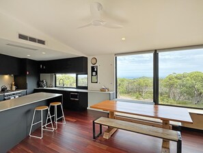 Modern open plan living area with a fully equipped kitchen.
