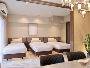Standard Suite Room Size: 75㎡ Bedding: 6 single beds + 1 double bed Capacity: Maximum 8 people