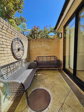 Cozy patio corner with vintage vibes—perfect for relaxed mornings or golden hour chats.