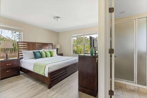Beautiful King size bedroom with green bedding details. 