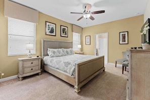Master bedroom with a king bed and nice little relaxing corner.