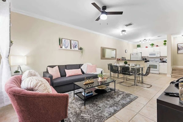 An open concept living room and dining room with charming and romantic decoration.