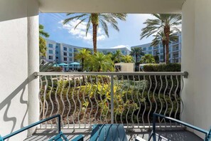 A private balcony with a breathtaking pool view, offering the perfect spot to unwind.