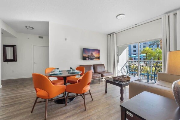 A cozy living room with an open-concept dining and kitchen, perfect for family time.