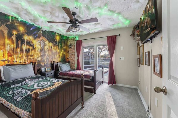 A Harry Potter-inspired bedroom featuring a TV, ideal for enjoying your favorite movie.