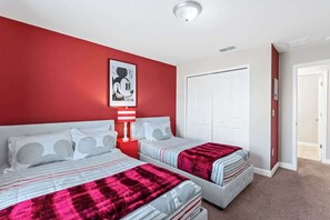 Experience the versatility and comfort of our themed upstairs bedroom, featuring a full-size and a twin bed, promising a restful night's sleep in a captivating ambiance.