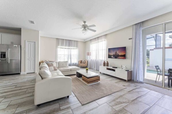 The cozy and inviting living room, designed for ultimate comfort and relaxation. This space features plush sofas and stylish furnishings, perfect for lounging after a day of adventures.
