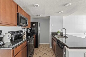 Fully equipped Kitchen with stainless steel appliances.