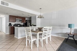 The dining room integrates with the living room and kitchen, and accomodates 6 people.