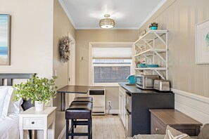 Includes a mini fridge, microwave, toaster, and coffee maker for added convenience.