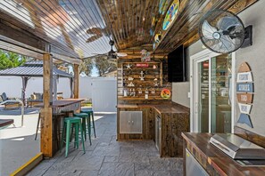 Unique indoor-outdoor bar space with a cozy, inviting atmosphere.