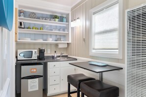 Everything you need in one spot — a functional kitchenette perfect for light cooking and snacks.