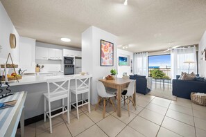 The open plan kitchen, dining & living is vibrant and inviting.