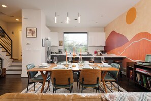 Gather around this beautifully set dining table, where modern elegance meets warm southwestern charm. Whether you're hosting a home-cooked meal, celebrating a special occasion, or simply enjoying a candlelit dinner, this space is designed to create memorable moments.