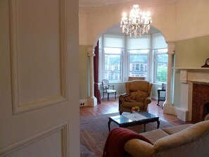 Large living room with entertainment centre (tv, music, and DVD library) 