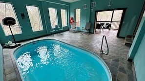 Secured lower level heated indoor pool with deck for you to enjoy.