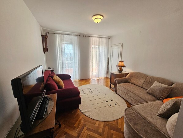 living room with couch for 2 persons