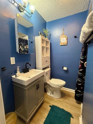 Modern bathroom with fresh towels and all essentials for comfort.