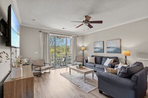 Serene balcony seating with sofa, chairs, plus games and a brand new SMART TV!