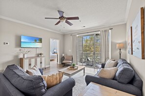 Spacious, bright living room with pull-out twin and full-size sleeper sofas.