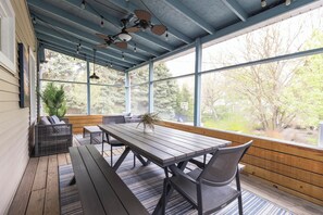 Charming dining and seating in the screen porch
