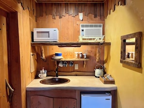 Microwave, mini fridge,hot water kettle, filter for coffee, some dishes/utensils