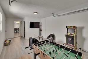 Challenge friends to foosball, hit the old-school arcade, or chill with a movie on the TV