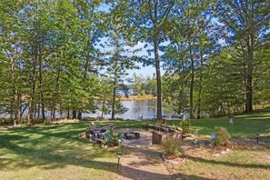 Lake and back yard with large firepit