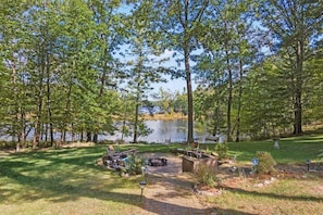 Lake and back yard with large firepit