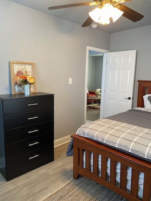 A queen bed and sitting area.