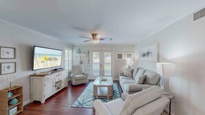 Classic French doors accentuate the charm and warmth of the living room as they invite you to step out onto the private patio.
