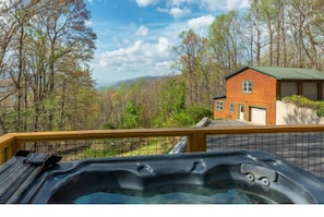 Soak in the hot tub and mountain views after a full day of adventure in Asheville