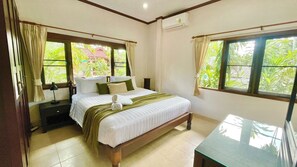 Bedroom 1, with king bed, aircon, wardrobe, clothes rail, dressing table and en-suite bathroom