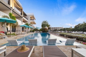 Relax in the O Condominium Sol Deck residence pool