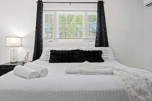 Bedroom 7: Unit 7 - Simple elegance for a restful night's sleep. Discover tranquility here.