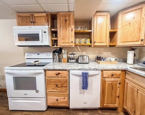 A four burner electric range, microwave and dishwasher are available for use for guests