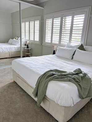 King bed in master bedroom with ensuite