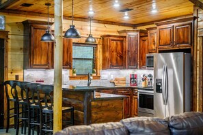The warm, open kitchen offers ample space & all the comforts of home