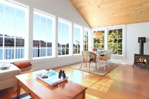 Brilliant views and natural light flood the living and dining areas.